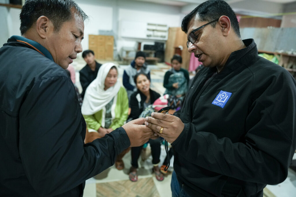 WCOI partners teaching man how to use MegaVoice