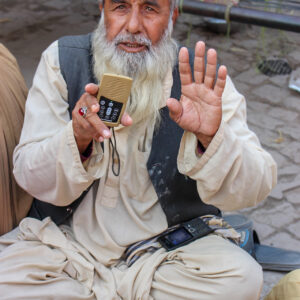 WM Afghan Audio Bible Distribution Afghan Elder holding up MegaVoice player